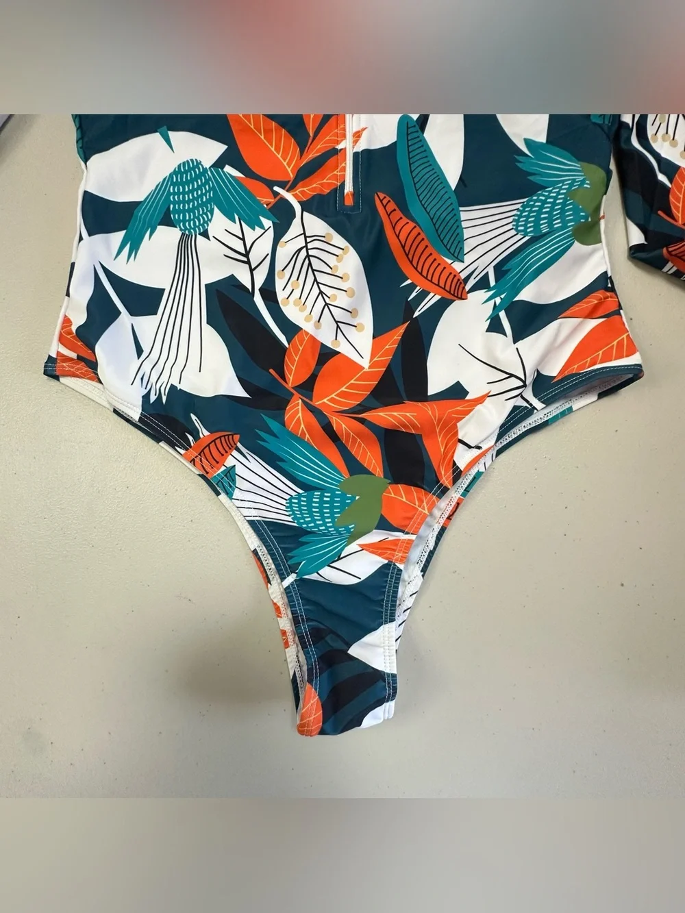 Long-Sleeve Teal Floral One-Piece Swim Suit with Front Zip